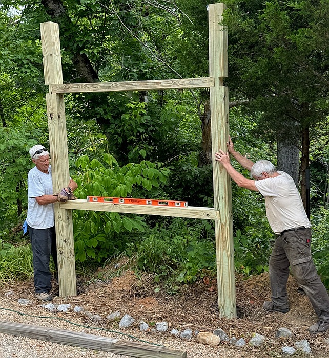Rodney & Mark Getting the Frame in Place to be Cemented.